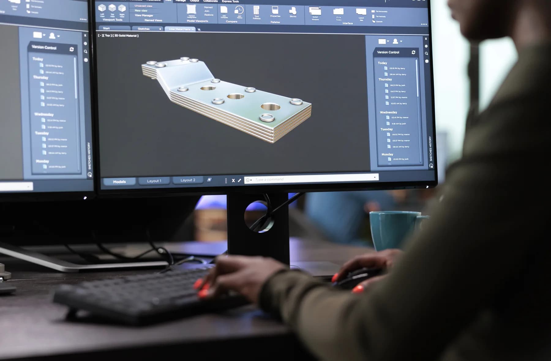 An engineer modelling a component in CAD software