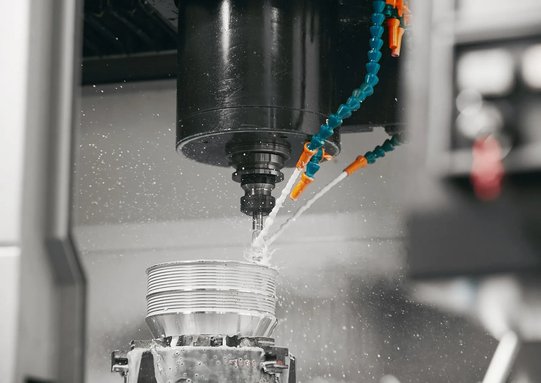 A precision part being machined on a CNC mill