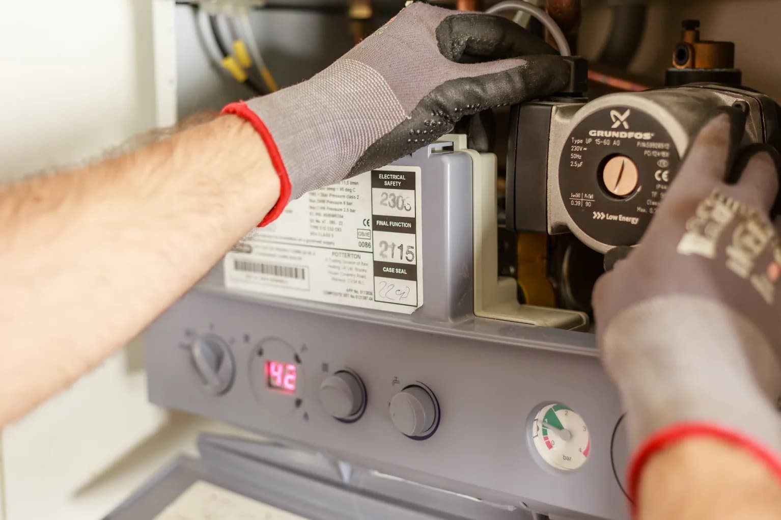 An engineer servicing an instrument's internal components during a maintenance visit